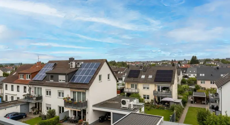 Modern German electrical meter cabinet (Zählerschrank) with smart meter and solar inverter connection, clean technical installation